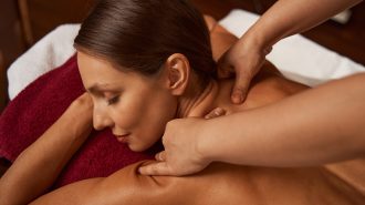 Beauty salon customer getting trigger point massage